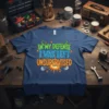 Blue t-shirt with the text "IN MY DEFENSE I WAS LEFT UNSUPERVISED" in colorful, bold lettering, featuring an explosion graphic