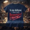 Navy blue t-shirt with white and red text reading "In my defense I was left Unsupervised" and red neon lines