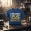Blue t-shirt with yellow and white text "In My Defense I Was Left Unsupervised" and wrench graphic, set in a