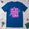 In My Double Digits Era (10th birthday version) text with retro font and butterfly graphics on a blue t-shirt