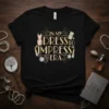 In My Dress To Impress Era text with fashion graphics including a dress, lipstick, and jewelry on a black t-shirt