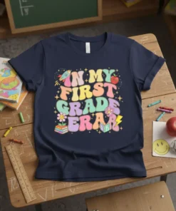 In My First Grade Era text in colorful retro groovy font with rocket, apple, flowers, and stars graphics on a