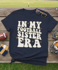 In My Football Sister Era t-shirt design with retro wavy font in cream and gold accents