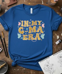 Retro "In My G-Ma Era" t-shirt design with gold glitter text and pastel butterflies and flowers