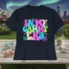 Retro "In My Gammy Era" text with colorful butterflies and flowers on a dark t-shirt