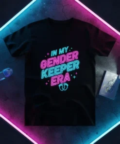 In My Gender Keeper Era neon text design with baby footprints on a black t-shirt