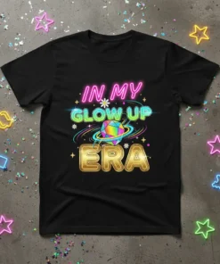 Black t-shirt with neon text "IN MY GLOW UP ERA" and a colorful geometric gem graphic