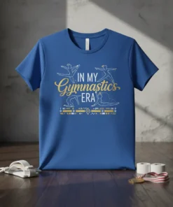 Blue t-shirt with gold text "IN MY Gymnastics ERA" and silhouette gymnasts performing moves