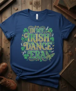 T-shirt with "In My Irish Dance Era" text, surrounded by shamrocks and floral elements, with a butterfly graphic
