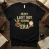 In My Last Day of School Era t-shirt design with books, quill, and graduation clock