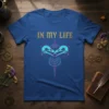 In My Life t-shirt design featuring two teal crow skulls forming a heart shape with gold distressed text above