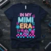 In My Mimi Era text design with retro disco ball, neon flowers, and butterflies on a navy t-shirt