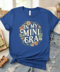 In My Mini Era text design with floral and butterfly graphics on a royal blue t-shirt