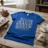 Royal blue t-shirt with "In My Nana Era" text in gold, surrounded by floral and butterfly graphics