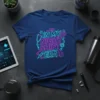 Blue t-shirt with neon pink and blue text "In My Night Shift Era" and medical graphics like a stethoscope and