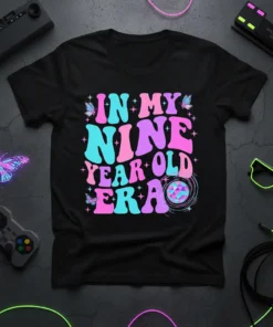 In My Nine Year Old Era text design with butterflies and disco ball graphic, vibrant retro colors, on a black