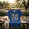 T-shirt with "In My Nonna Era" text surrounded by a gold floral wreath and fairy lights