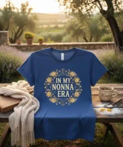 T-shirt with "In My Nonna Era" text surrounded by a gold floral wreath and fairy lights