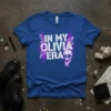 In My Olivia Era text design with lightning bolts and skull graphic on a blue t-shirt