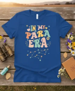 Retro groovy "In My Para Era" text design with stars and flowers on a blue t-shirt