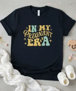 In My Pregnant Era maternity t-shirt with retro font and baby feet graphic