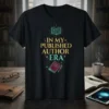 In My Published Author Era text design with an open book and pen graphic on a black t-shirt