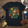Retro "In My Rich Auntie Era" text design with a crown on a dark t-shirt