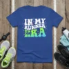 Blue t-shirt with white text "IN MY RUNNER ERA" and a graphic of a runner