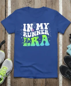 Blue t-shirt with white text "IN MY RUNNER ERA" and a graphic of a runner