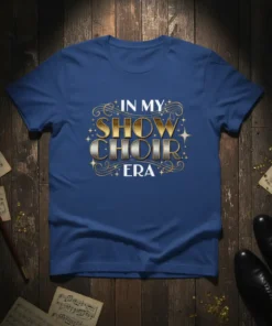 In My Show Choir Era text design with gold and silver lettering and decorative swirls on a blue t-shirt