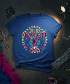 In My Showgirl Era text design with a crown and colorful feathers on a blue t-shirt
