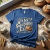 Blue t-shirt with "In My Sourdough Era" text and a graphic of a sourdough loaf, jars, and wheat stalks