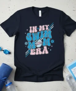 Retro "In My Swim Mom Era" text design with a swimming graphic, stars, and flowers on a navy t-shirt