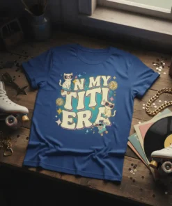 In My Titi Era text with cats on roller skates, disco balls, and stars, on a blue t-shirt