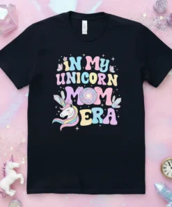 In My Unicorn Mom Era text with a unicorn graphic, stars, and crystals on a black t-shirt