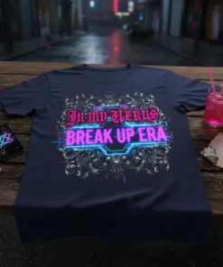 Navy t-shirt with "In My Uterus Break Up Era" in neon pink and blue gothic font, surrounded by ornate silver