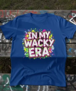 In My Wacky Era text design with retro graffiti, skulls, and safety pins on a blue t-shirt