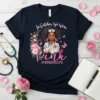 In October We Wear Pink #Nurselife t-shirt design featuring a Black nurse with pink flowers and butterflies