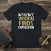 Black t-shirt with white and gold text reading "IN SILENCE WISDOM FINDS EXPRESSION"