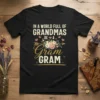 Black t-shirt with "In a world full of Grandmas be a Gram Gram" text, floral graphic, and hearts