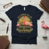 In a World Full of Grandmas Be a Grammingo text with flamingo graphic on navy t-shirt