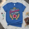 In A World Full Of Grandmas Be A Nana text with crown and hibiscus flower on a blue t-shirt