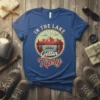 In The Lake Gettin' Tipsy retro design with mountains, lake, and canoe, on a blue t-shirt