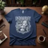 Indoorsy t-shirt design featuring a vintage armchair, sleeping cat, fireplace, and books, perfect for homebodies and book lovers