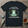 Meditating cat graphic with text "inner peace begins with four words: not my fucking problem" on a black t-shirt