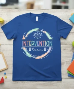 Blue t-shirt with "INTERVENTION team" text inside a colorful circular design, featuring a small heart graphic