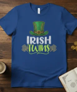 Blue t-shirt with "IRISH TWINS" text in white and green, featuring a green leprechaun hat and shamrocks