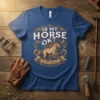 Is My Horse Ok? Is Trclblesy text with a running horse graphic and equestrian elements on a blue t-shirt