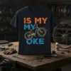 Black t-shirt with "IS MY MY OKE" text and a vintage bicycle graphic