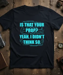 Black t-shirt with bright blue neon-style text "IS THAT YOUR PROP? YEAH, I DIDN'T THINK SO." and circuit board graphic